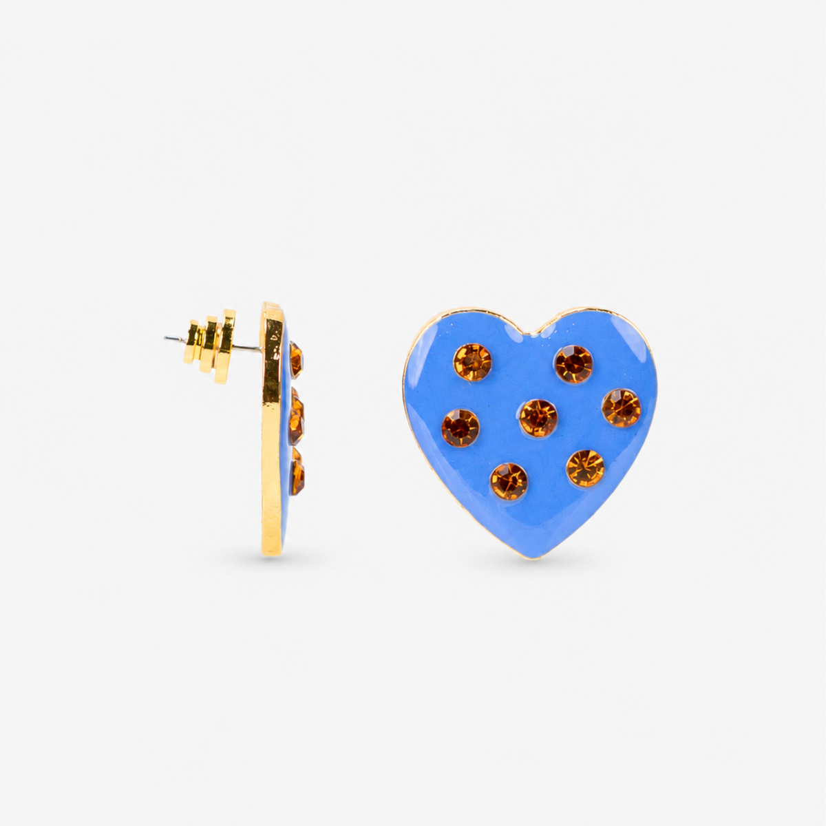 Sassy Jones Lovebug heart earring in Paradise Blue with seven jeweled accents arranged across the heart. Blue heart stud earrings featuring a glossy finish, warm golden crystals and polished gold detailing.