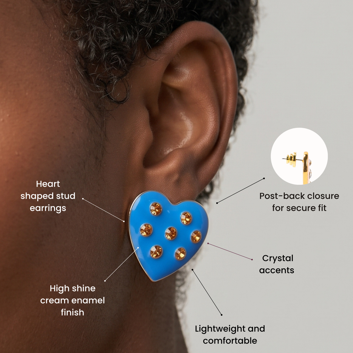 Bright blue heart statement stud earrings featuring seven round golden crystal embellishments.