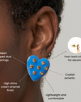 Bright blue heart statement stud earrings featuring seven round golden crystal embellishments.