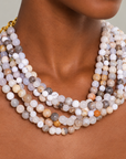 Makemba hand beaded collar necklace featuring layered strands of naturally patterned Botswana agate beads in soft neutral colors.