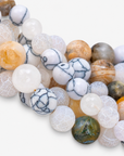 On model view of Makemba Ivory Estate necklace featuring layered Botswana agate beads and chunky gold chain detailing.