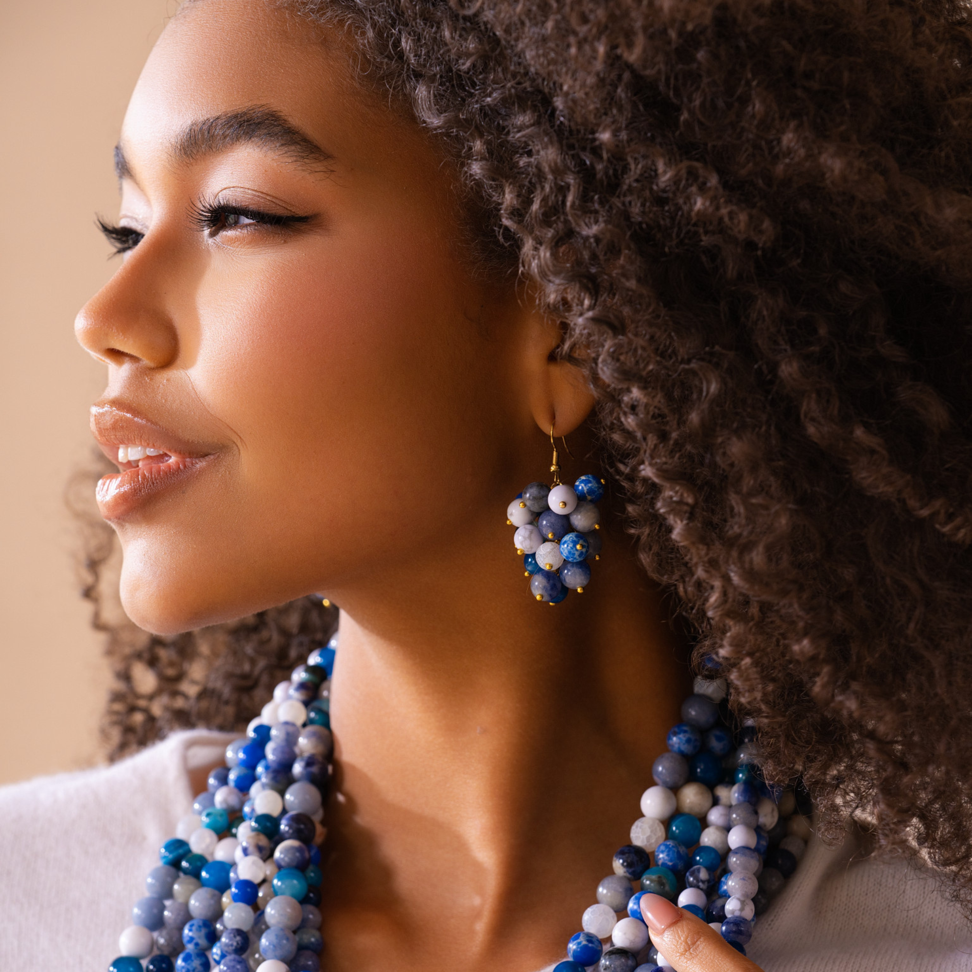 statement earrings for women, dangle earrings with gemstones, lapis lazuli earrings, artisan earrings, blue stone earrings, bold fashion earrings, clustered bead earrings, luxury statement earrings, modern gemstone earrings, boutique earrings for women