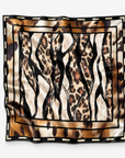 Mary Butler Leopard Abstract Oversized Square Scarf featuring layered leopard prints in caramel, cream, black and brown.