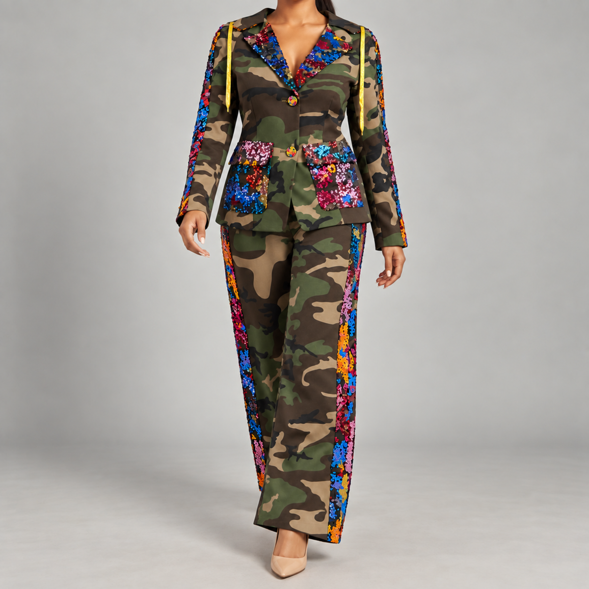 Multicolor sequin camo blazer featuring long sleeves, gold drawstring details and a tailored single button silhouette.