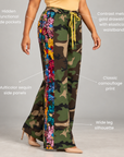Women's wide leg camouflage track pants with vibrant blue, pink, red and orange sequin detailing.