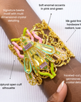 Sassy Jones Miss Beasley statement cuff with multicolor beetle motif and intricate sculptural gold scrollwork.