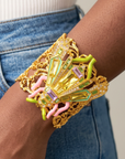 Miss Beasley Crystallique bracelet featuring an ornate insect centerpiece set against openwork floral inspired filigree.