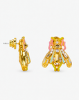 Miss Beasley Crystallique statement earrings shown on ear with sparkling wings and pastel accents.
