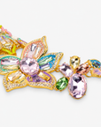 Close-up of Miss Beasley Crystallique Necklace showing dimensional flowers, sparkling beetles and Gold tone finish accents.