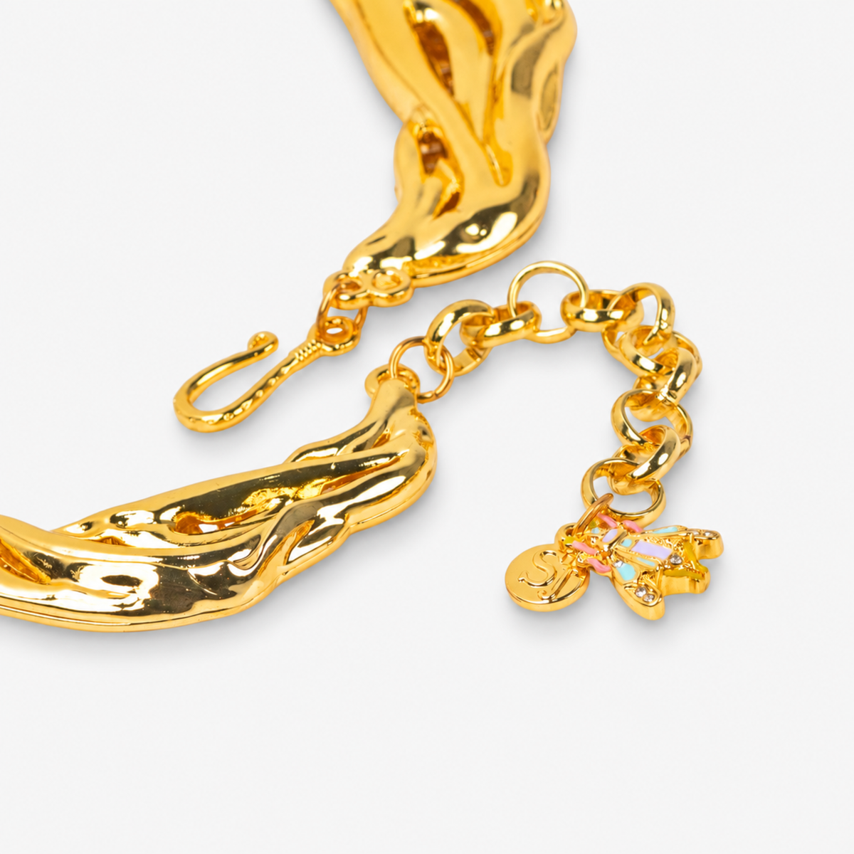 Close-up of Miss Beasley Crystallique Necklace showing the fish hook gold tone finish with the pastel beetle accents.