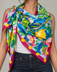 Sassy Jones Mykonos Scarf featuring a Mediterranean inspired garden illustration with lemons, pink blossoms and lush green foliage.