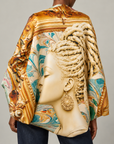 Sassy Jones Nika Scarf featuring a 51 inch square design with a regal female portrait and colorful marble inspired background.