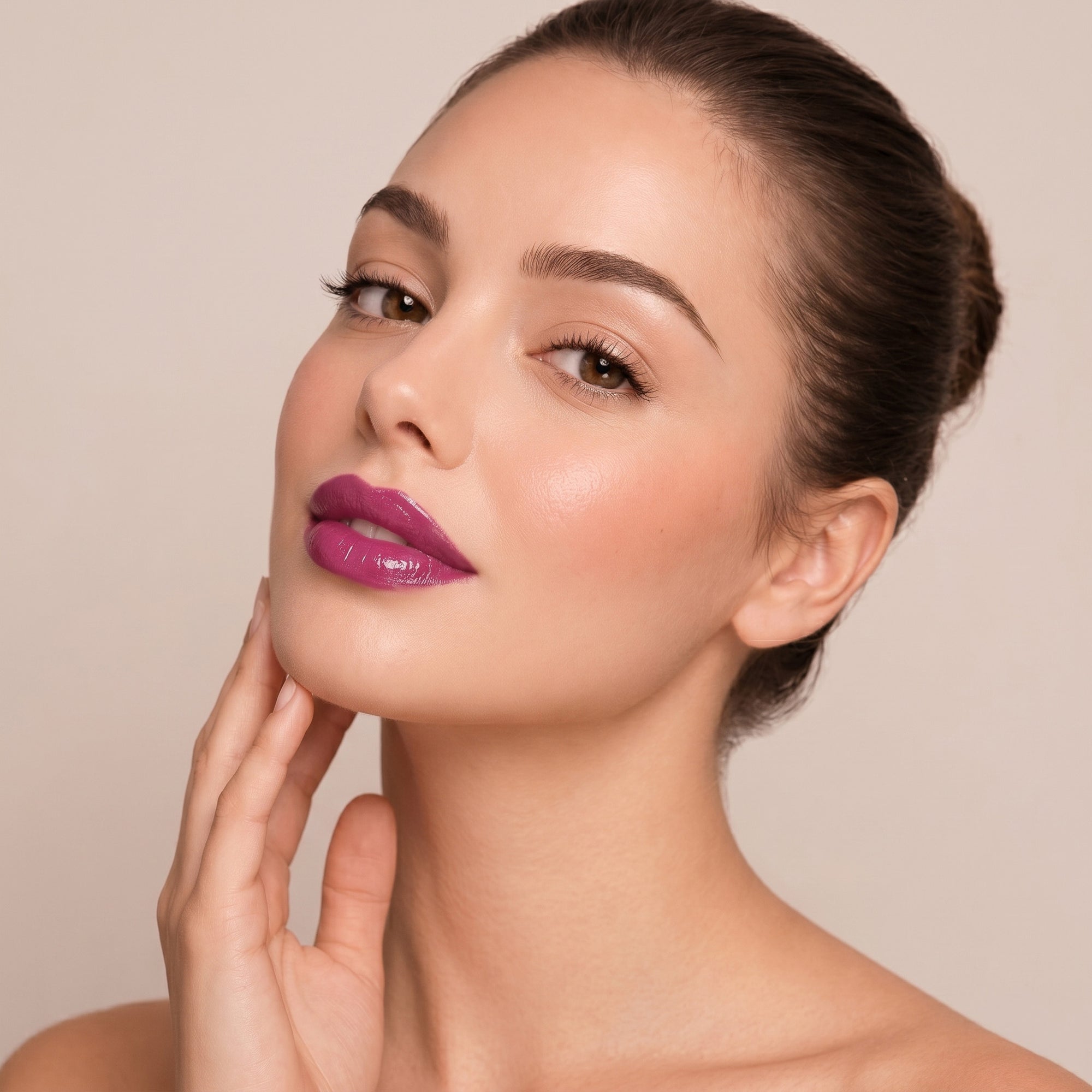 Soft rose lipstick in gold tube with pink mauve swatch for a natural, polished everyday lip look.