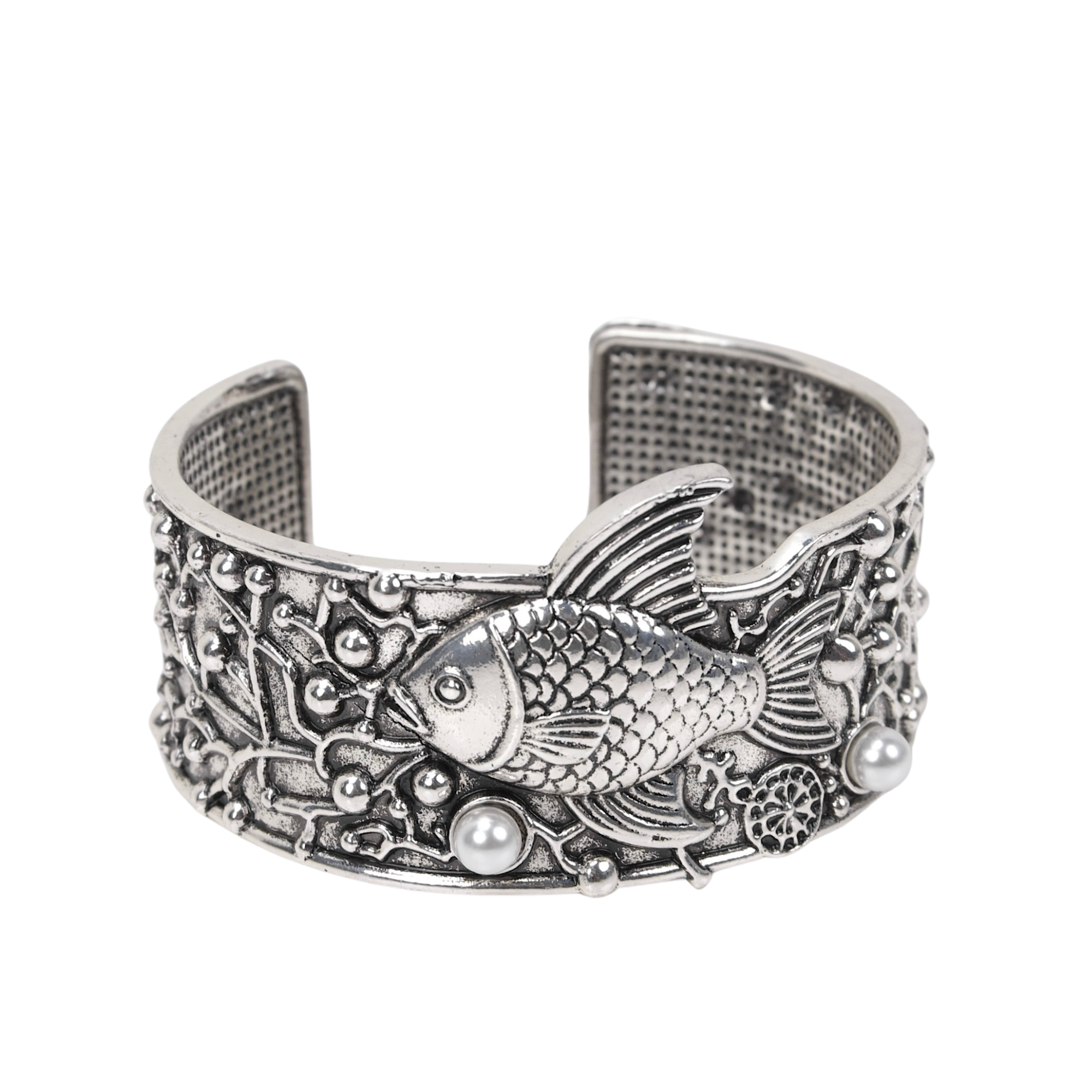 Antiqued silver open cuff bracelet featuring a sculpted fish, coral inspired textures, luminous pearl accents, and intricate ocean detailing.