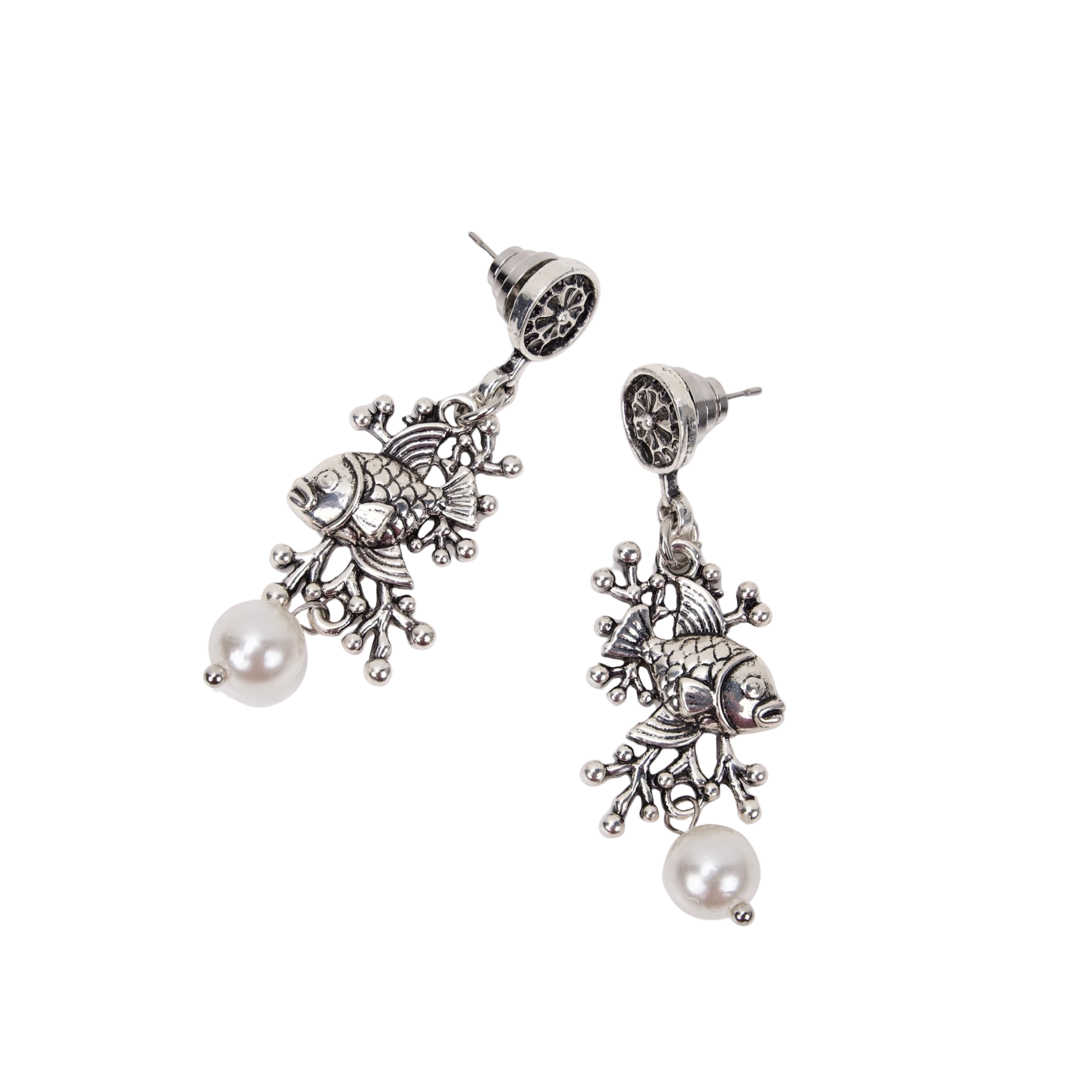 Antiqued silver fish dangle earrings featuring coral inspired detailing, luminous pearl drops, and sculptural ocean inspired elements.
