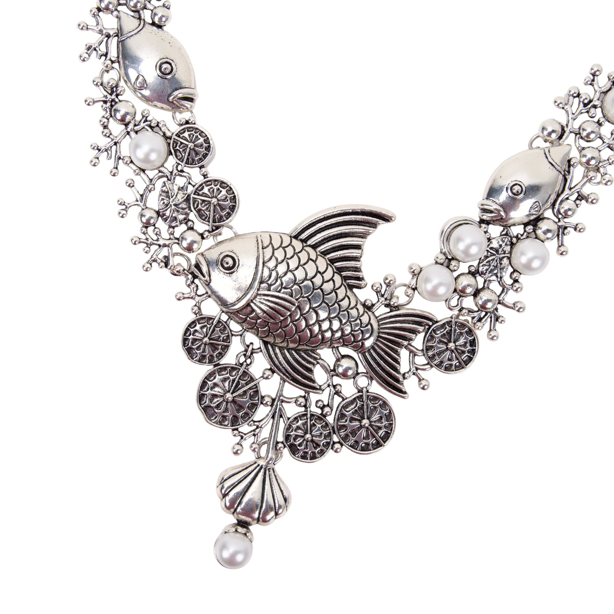 Antiqued silver statement necklace featuring sculpted fish, coral inspired branches, luminous pearl accents, shell details, and intricate ocean textures.