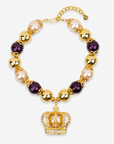 Reign Champagne Pearl Pavé Crown Statement Necklace with plum, champagne and gold beads and jeweled crown pendant.