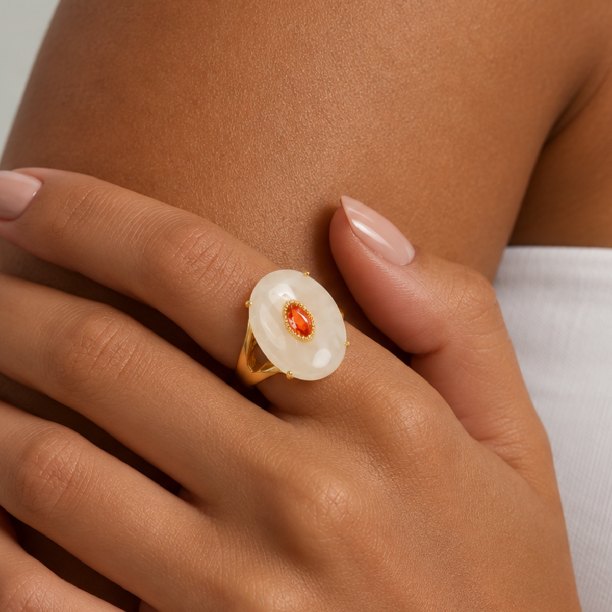 Sassy Jones Samira Moonstone Ivory ring featuring an oversized creamy stone in a sculptural gold setting.