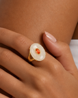 Sassy Jones Samira Moonstone Ivory ring featuring an oversized creamy stone in a sculptural gold setting.
