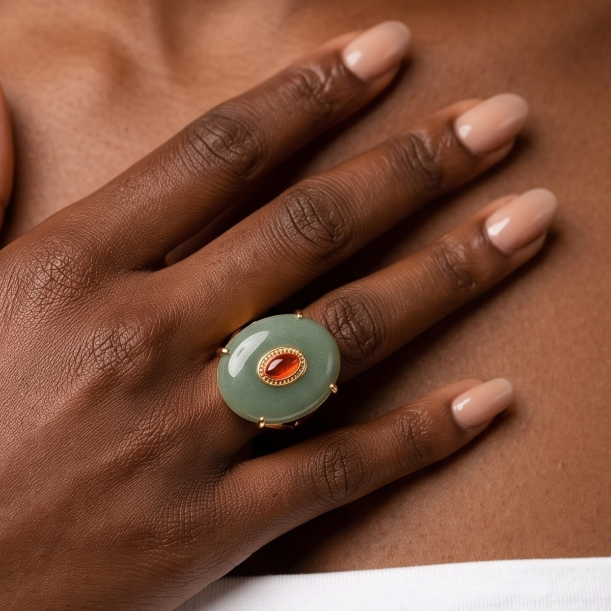 Sassy Jones Samira Jade ring featuring an oversized natural stone silhouette with a small warm toned center detail.