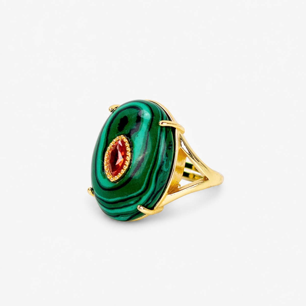 Green statement ring featuring dark malachite inspired stripes, contrasting center stone and Gold tone finish.