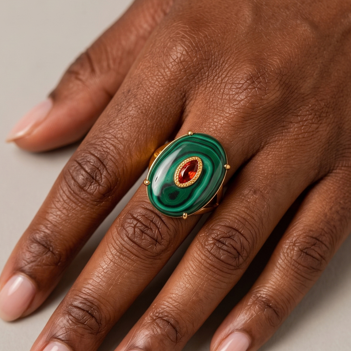 Sassy Jones Samira Malachite ring featuring a sculptural green stone with dramatic dark banding.