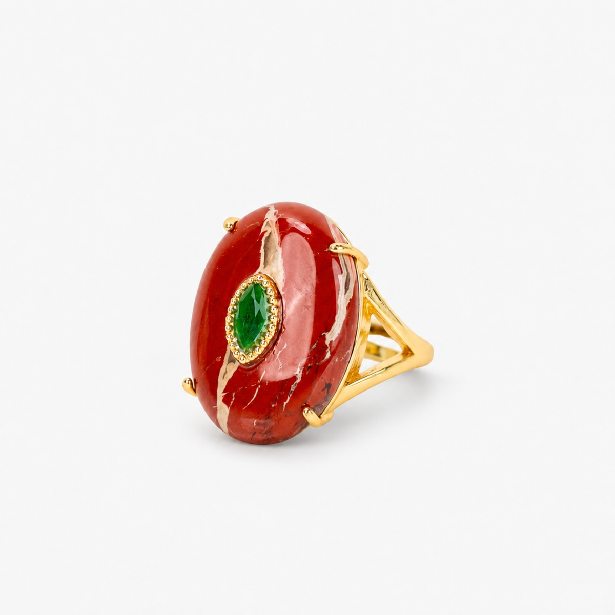 Mulberry Wine statement ring featuring a smooth deep red stone, jewel green center and Gold tone finish.
