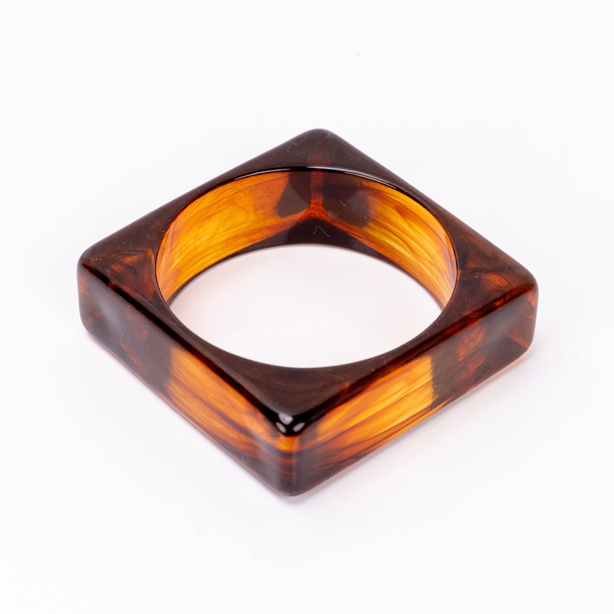 Glossy tortoise inspired statement bangle bracelet with amber and espresso marbled finish by Sassy Jones.