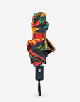 Colorful folding umbrella featuring circular designs, graphic stripes and African inspired patterns.