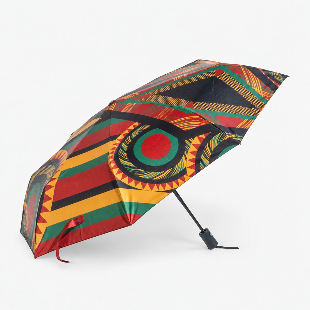Afrikaan Umbrella displayed open with a compact black handle and vibrant geometric print.