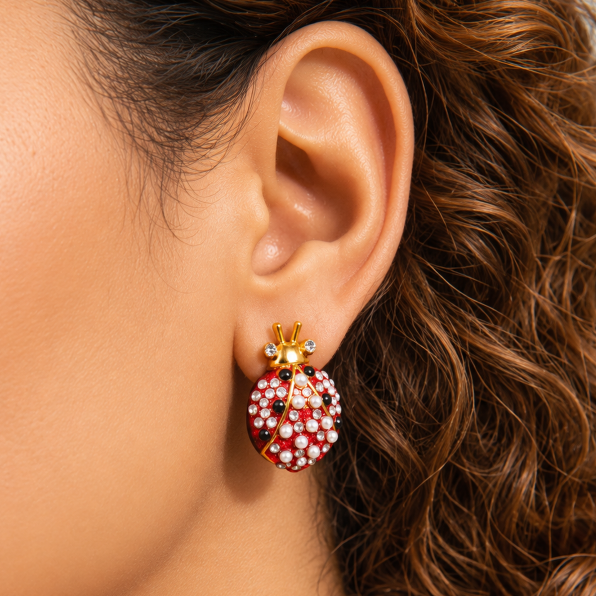 Close up of Scarlette Dainty Pearl Stud showing a jeweled red ladybug with pearl covered wings and crystal tipped antennae.