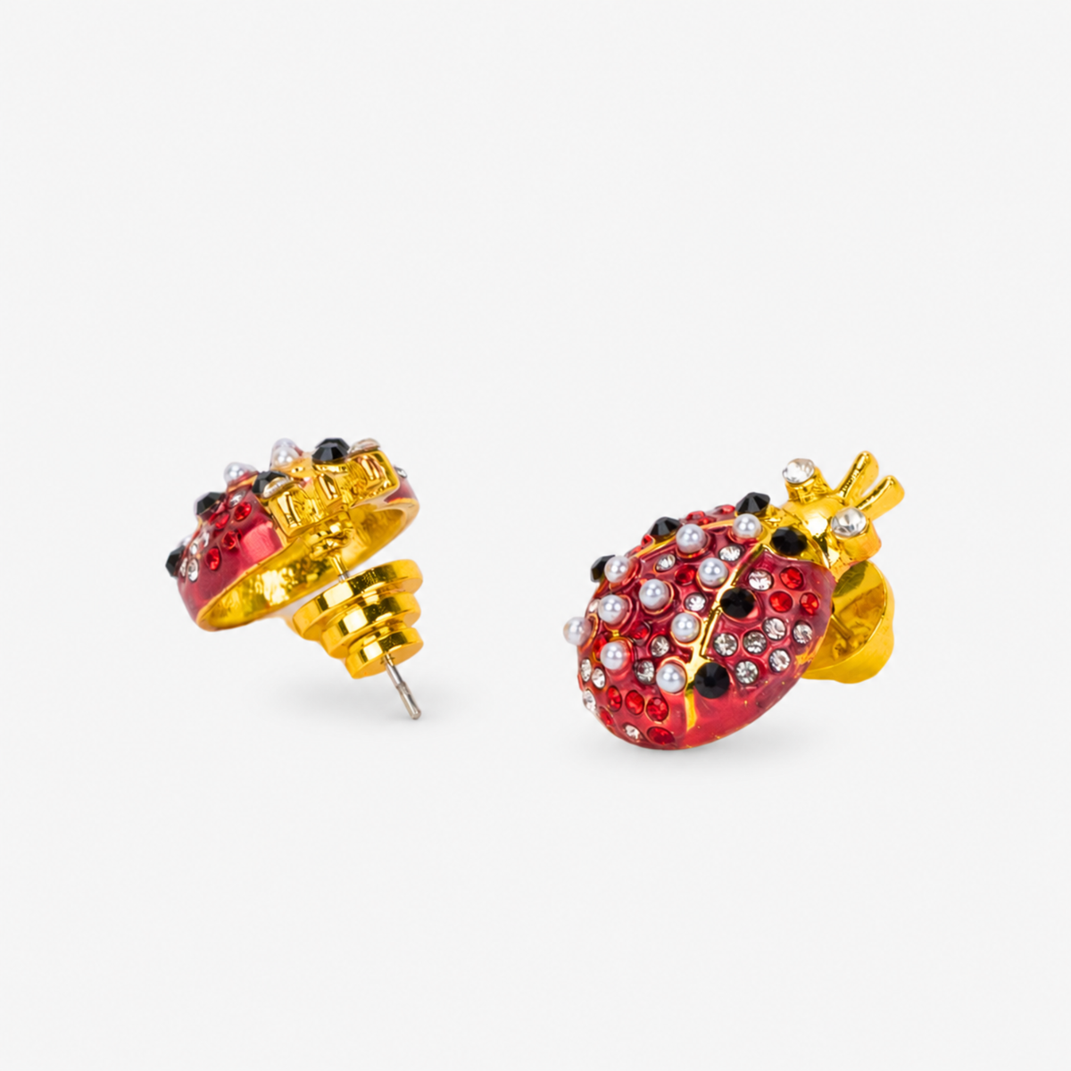 On model view of Scarlette Ladybug Stud Earring featuring red enamel, pearl details and Gold tone finish.