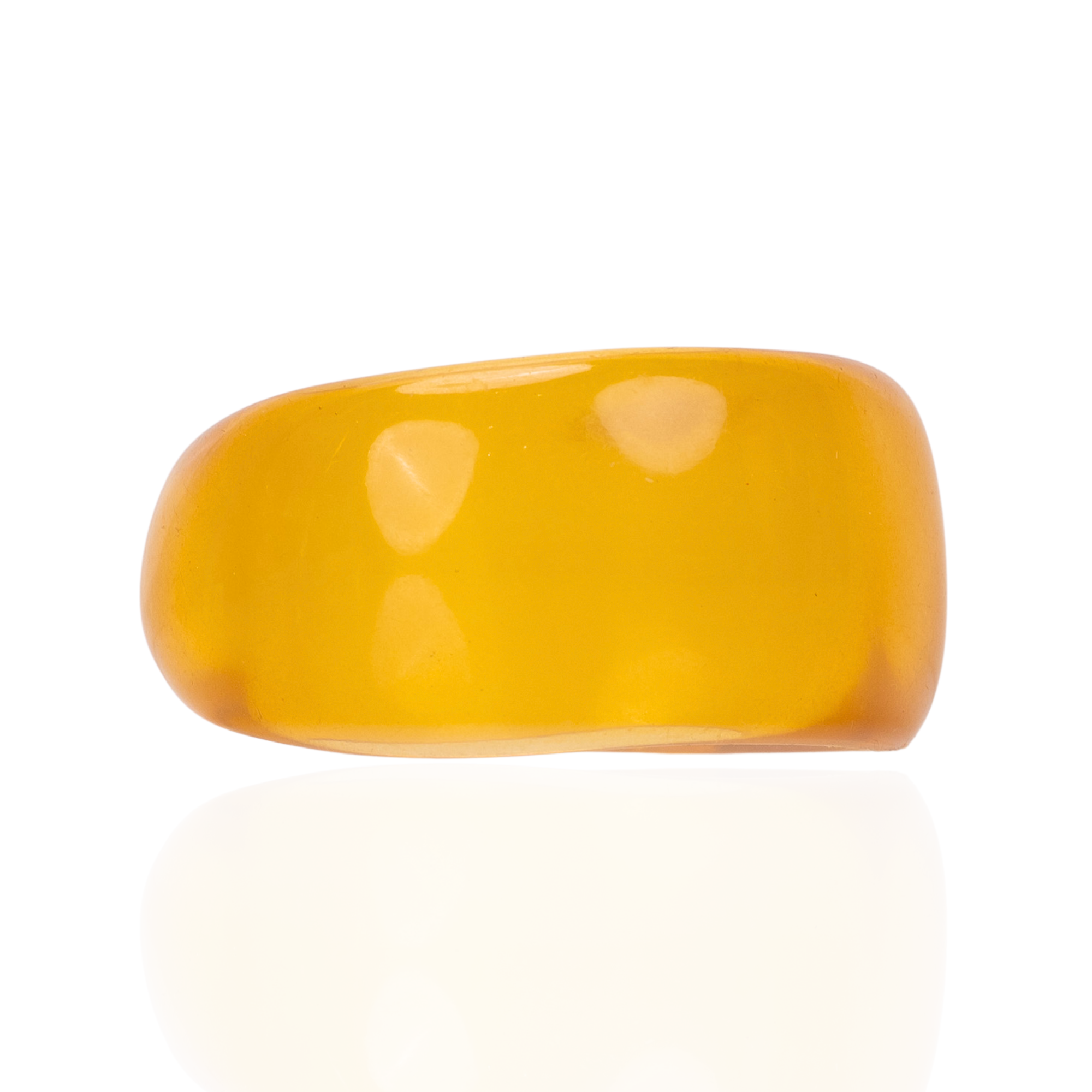 Glossy translucent golden yellow statement bangle bracelet with sculptural rounded silhouette by Sassy Jones.
