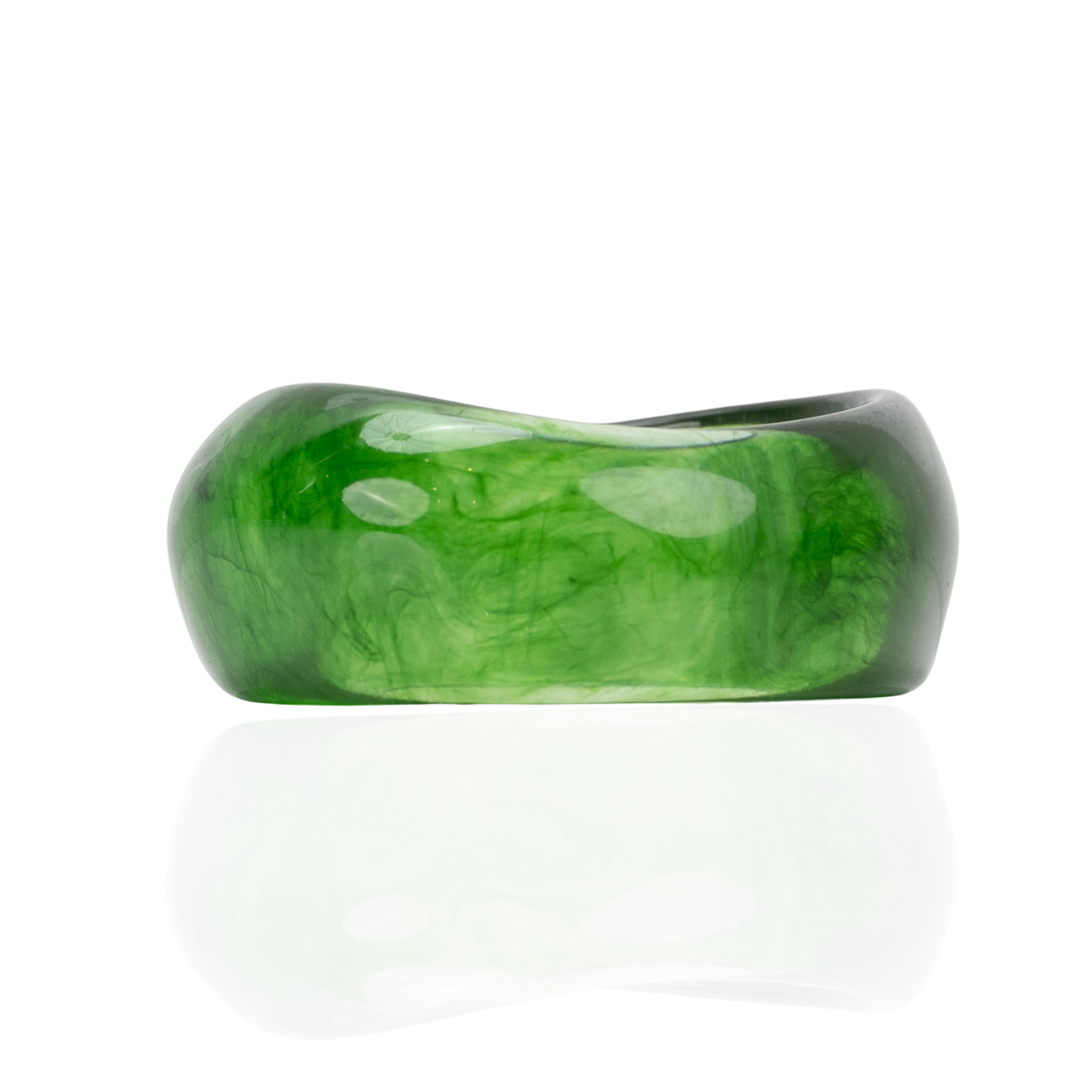 Glossy emerald green marbled sculptural statement bangle bracelet with fluid asymmetrical silhouette by Sassy Jones.