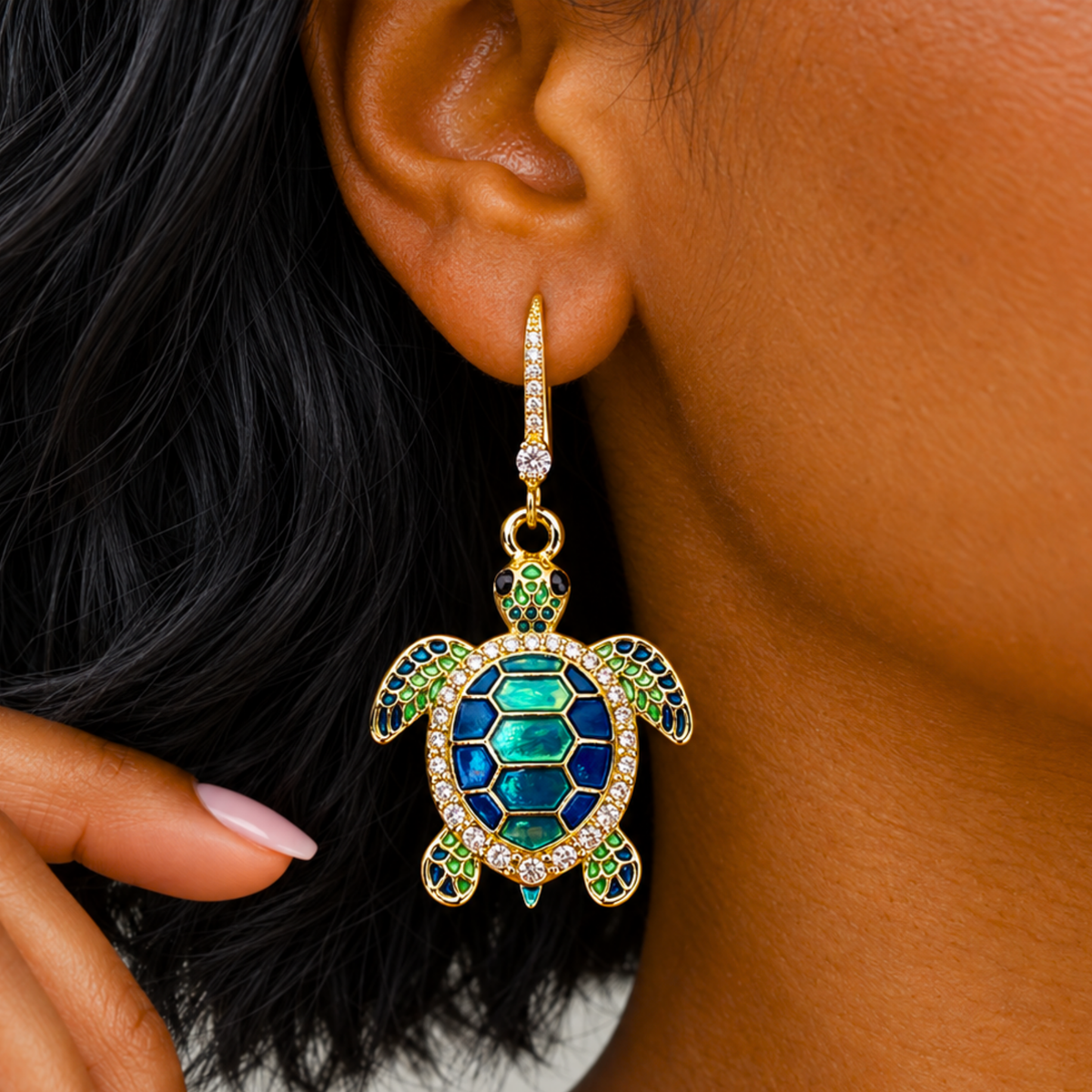 Sassy Jones Soleia statement earrings featuring jeweled sea turtle pendants suspended from crystal lined drops.