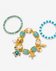 Soleia Sea Turtle 3pc Chunky Stack featuring turquoise, ivory, and gold beads with coastal charms.