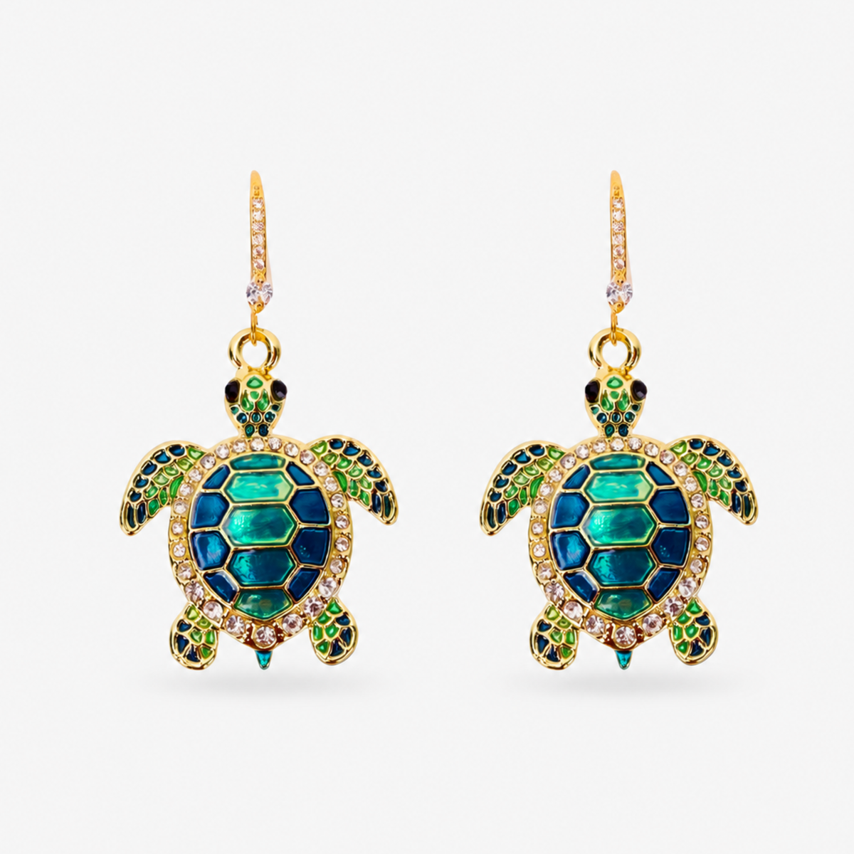 Sassy Jones Soleia statement earrings featuring jeweled sea turtle pendants suspended from crystal lined drops.