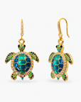 Sassy Jones Soleia statement earrings featuring jeweled sea turtle pendants suspended from crystal lined drops.
