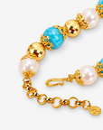 Chunky coastal statement necklace featuring oversized beads and a blue and green enamel sea turtle pendant.