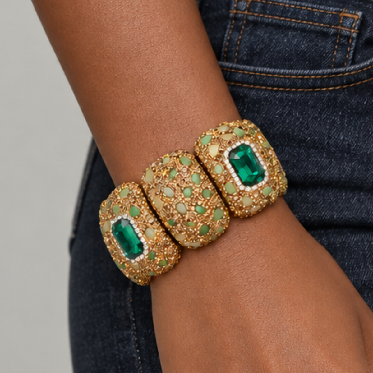 Sassy Jones Soraya Luxe Bracelet featuring rich green accents surrounded by warm metallic crystal embellishments.