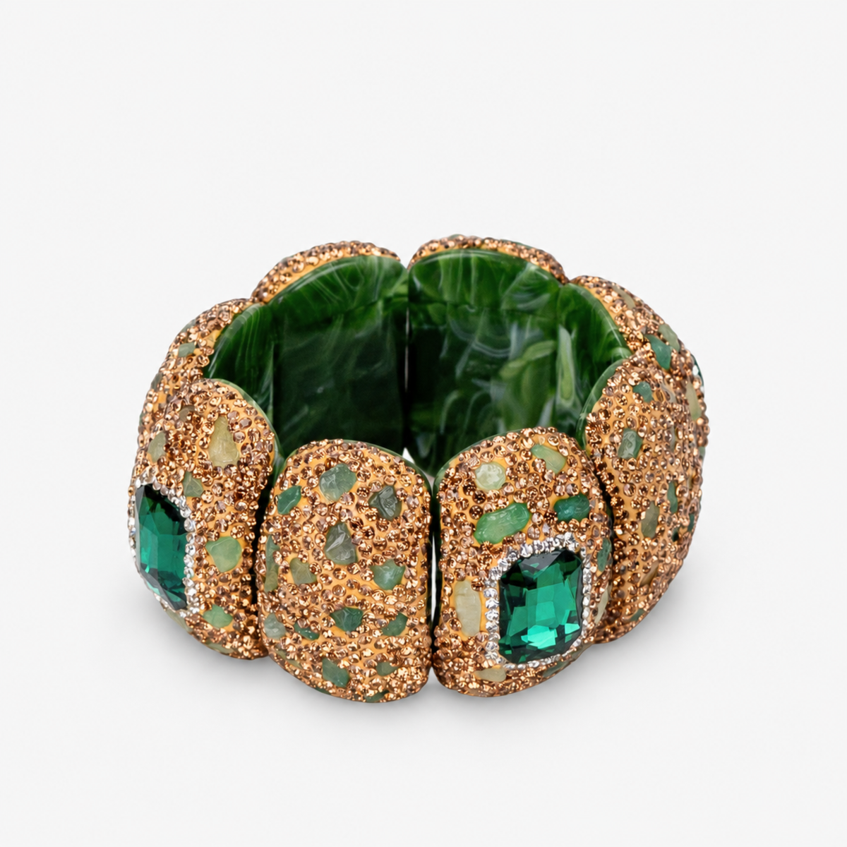Emerald statement stretch bracelet featuring a large faceted green centerpiece and Gold tone finish detailing.