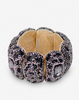 Black statement stretch bracelet featuring a large faceted onyx colored centerpiece surrounded by shimmering crystals.