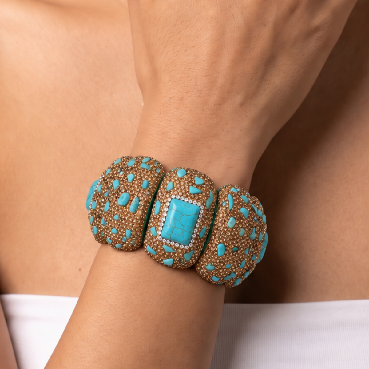 Sassy Jones Soraya Luxe Bracelet featuring chunky teal sections with scattered stone accents and warm metallic detailing.