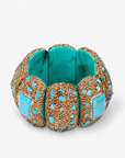 Teal statement stretch bracelet featuring a large veined blue green centerpiece surrounded by sparkling crystals.