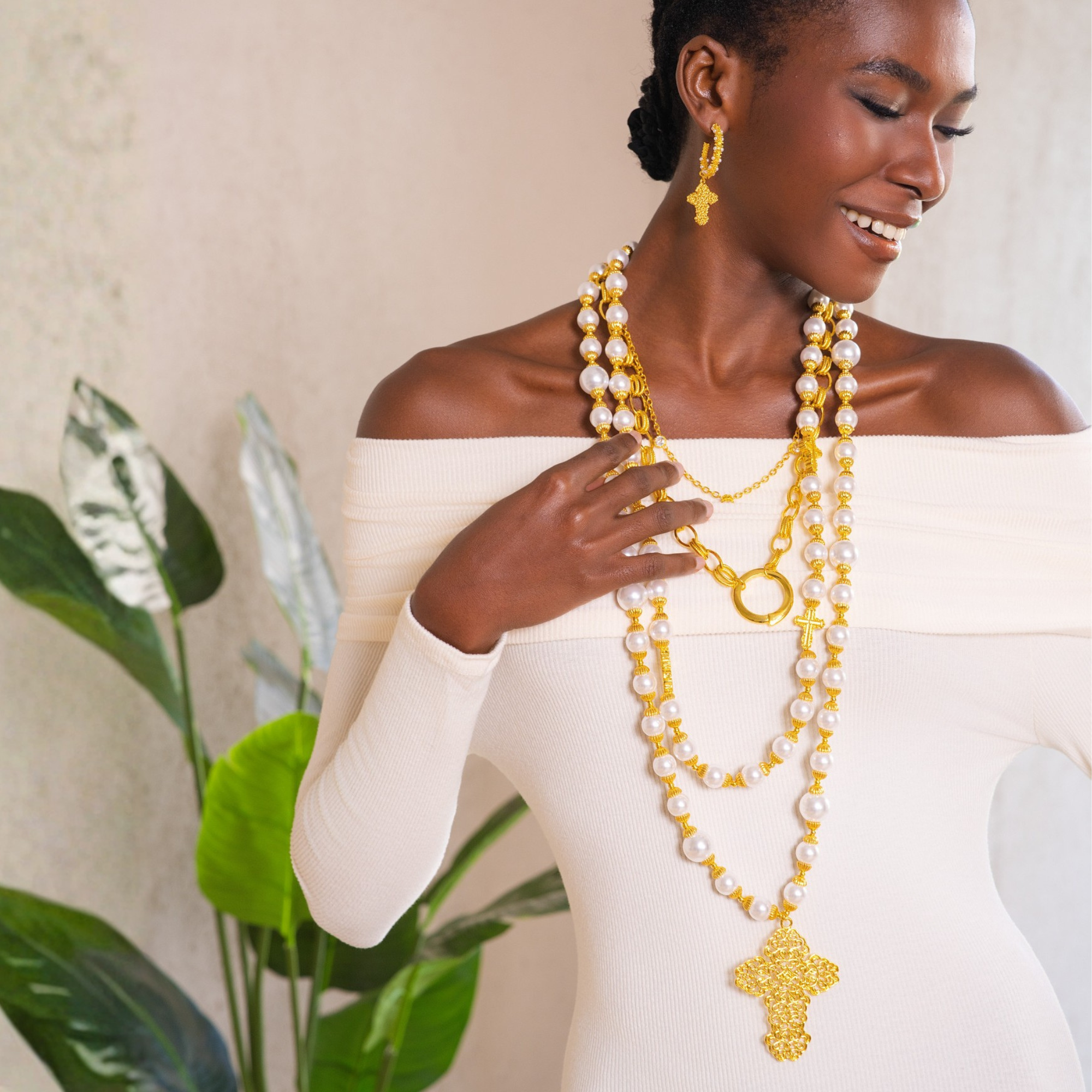 pearl statement necklace, cross pendant necklace, long pearl necklace, layered gold necklace, fashion pearl jewelry, dress chain necklace, luxury statement jewelry, women’s pearl necklace, bold cross necklace, boutique necklaces