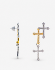 Trinity 18K Cross Sparkling Earrings featuring three cascading crystal crosses in gold and silver finishes.   Woman wearing Trinity statement earrings with layered gold and silver crystal cross motifs.   Sassy Jones Trinity drop earrings featuring three sparkling crosses in contrasting mixed metal finishes.   Close up of crystal cross earrings with a silver cross stud, gold center cross and dangling silver cross.   Trinity faith inspired earrings featuring cascading crystal embellished crosses in gold and s