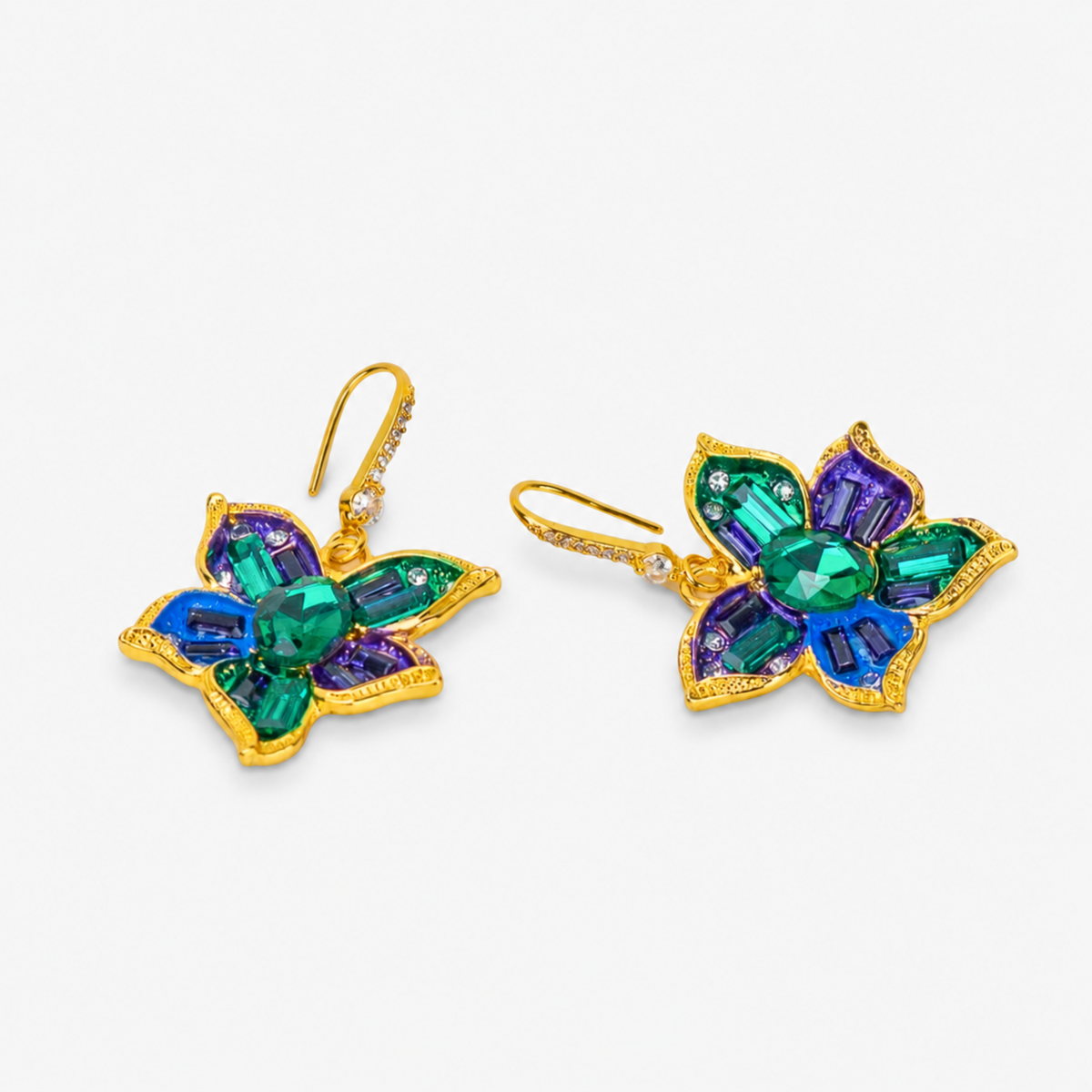 Vintage inspired statement earrings featuring sculptural jeweled flowers with Gold tone finish detailing.