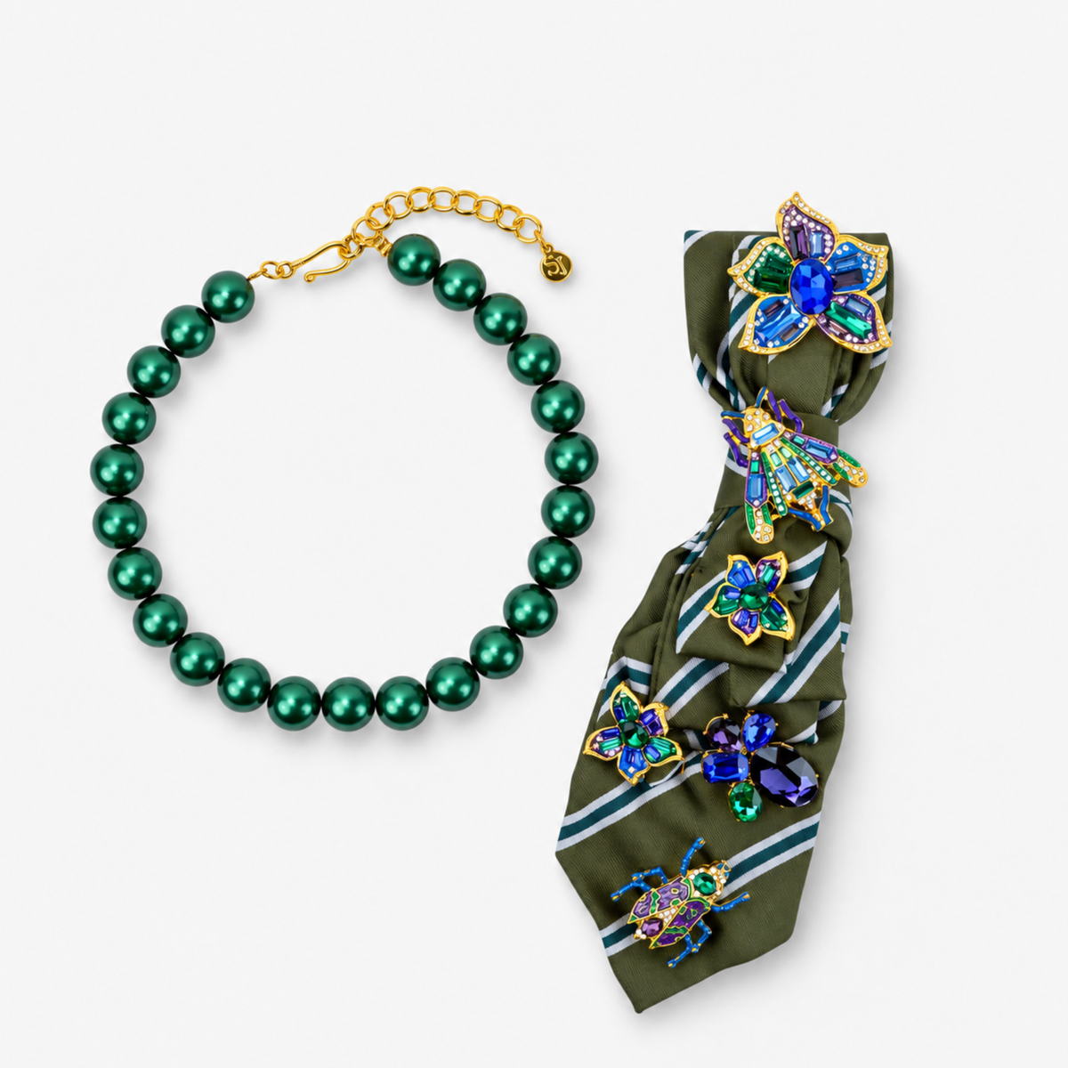 Sassy Jones Valerie Vintage Necktie featuring colorful crystal flowers and insect brooches on a striped olive green tie.
