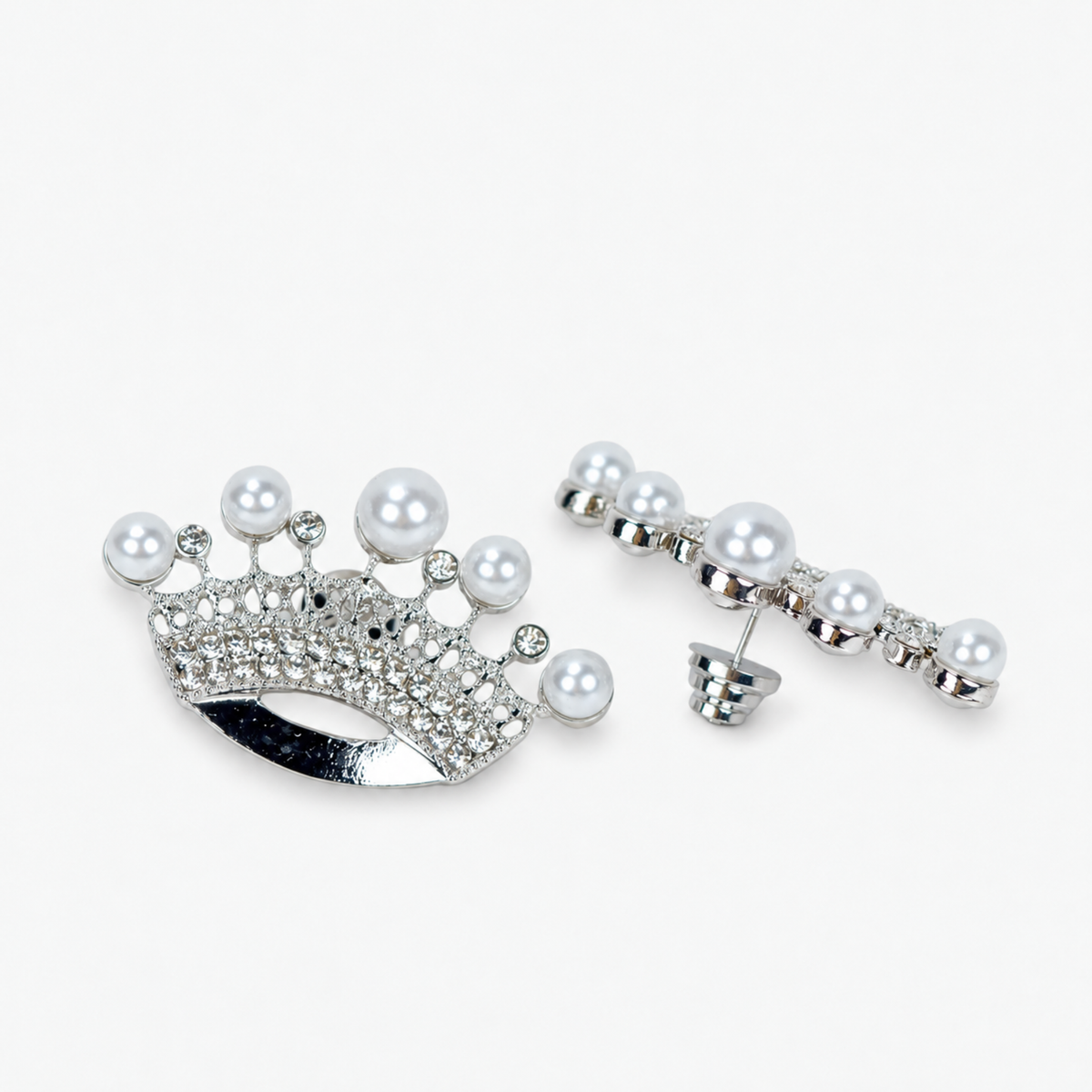 Sassy Jones Pearl Queen earrings featuring ornate silver finish crowns topped with luminous white pearls.