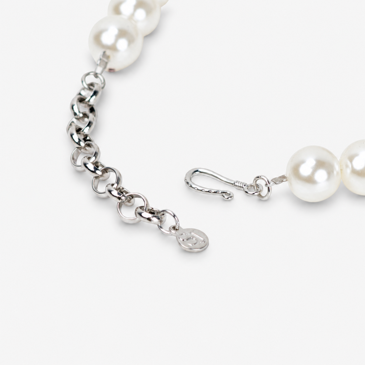 Vintage inspired statement necklace featuring luminous ivory pearl beads and an embellished cream necktie.